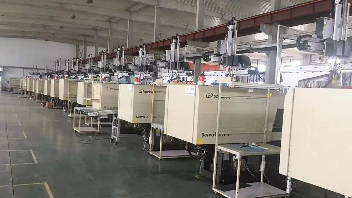 Factory assembly line with skilled workers assembling household cleaning products in uniforms