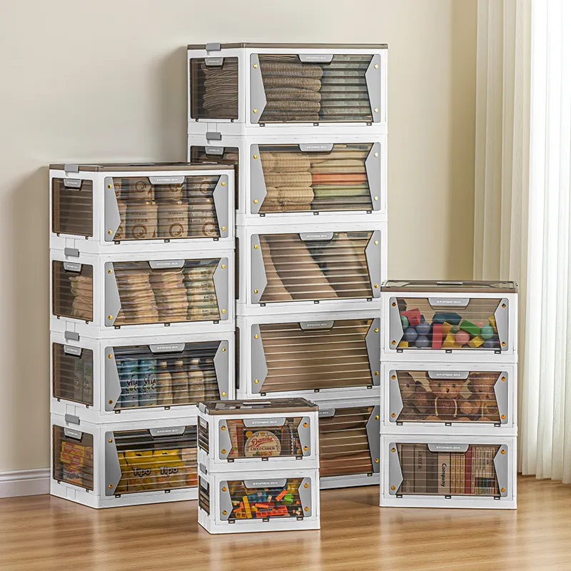 Stacked white foldable storage cabinets with clear front doors holding folded clothes in a living room