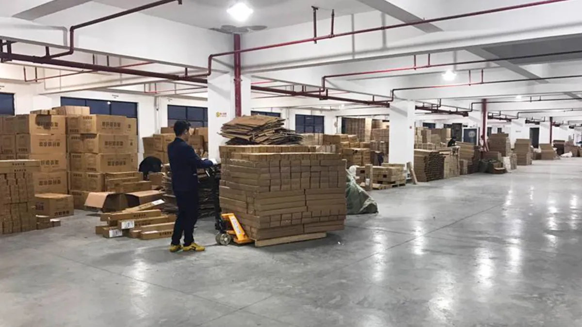 Fonoran finished goods warehouse with packed export cartons of household cleaning tools ready for shipment
