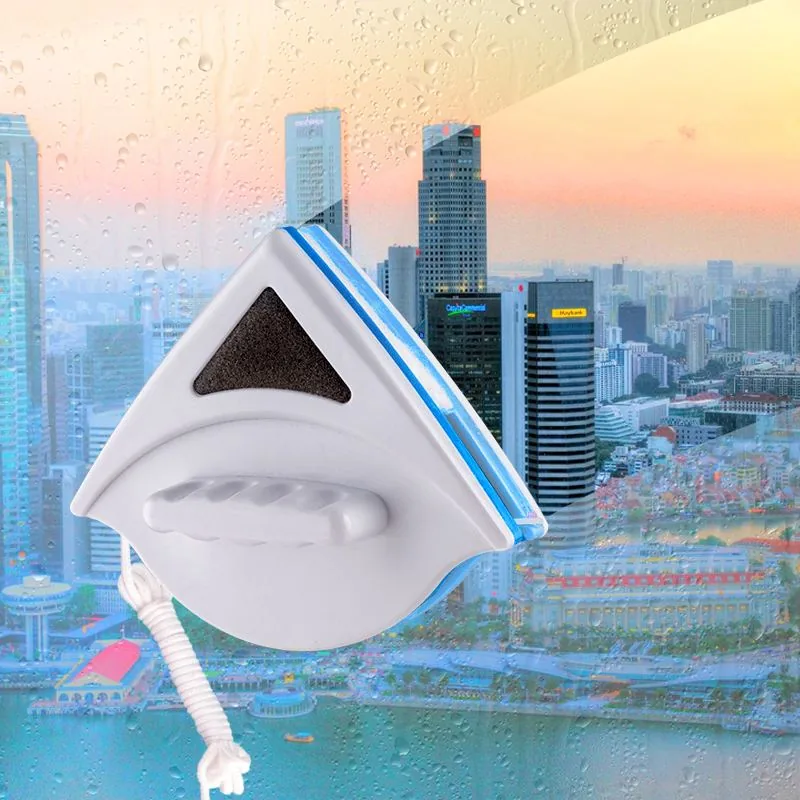 Fonoran magnetic window wiper for single-layer 3–8 mm glass against urban high-rise skyline — safety cord attachment