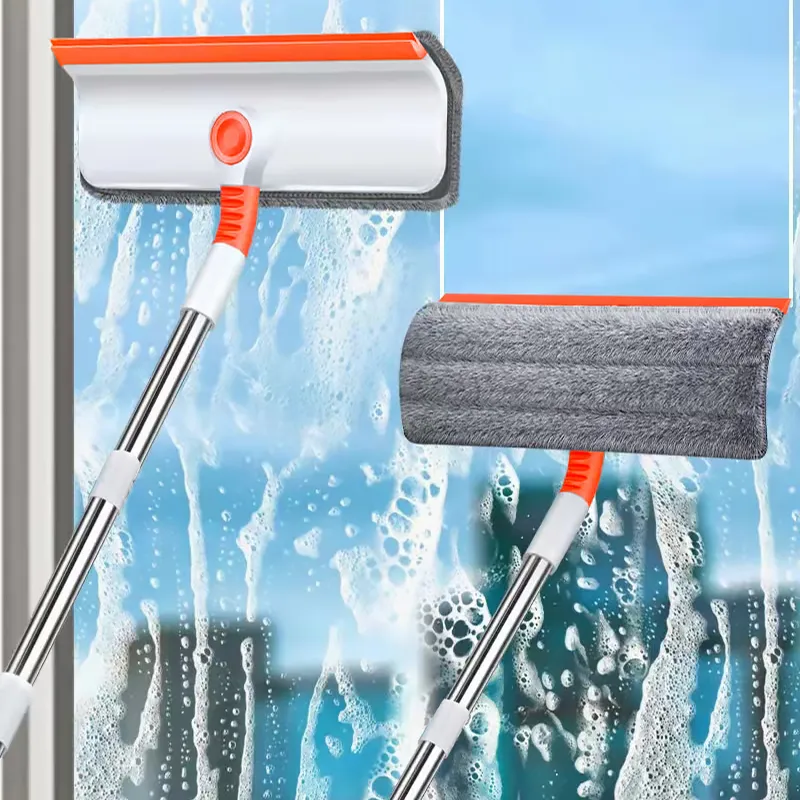 Orange and white Fonoran window squeegee and microfiber pad on stainless steel telescopic poles cleaning wet glass